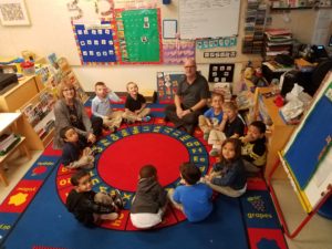 Preschool coordinator Kandy Clauss, at about 10 o'clock, sits in a preschool classroom with teacher Jonathan Clauss. Ms. Clauss is retiring in May after a long career in working with special needs children.