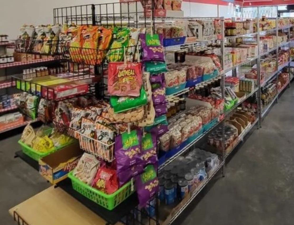 PHoto shows aisles of Cajun food, flavors, spices and snacks.