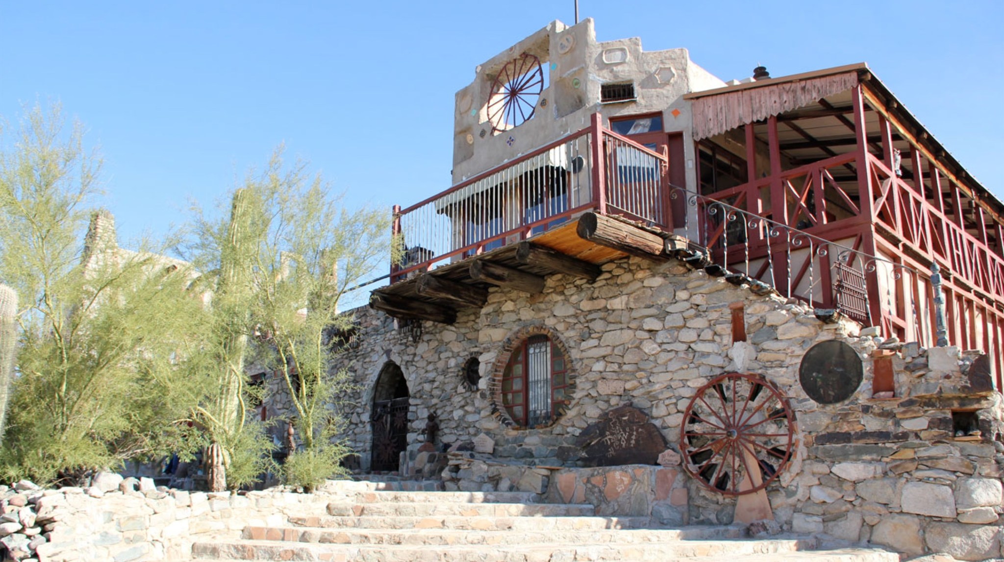 Photo shows the exterior of a stone building in South Phoenix known as the Mystery Castle.